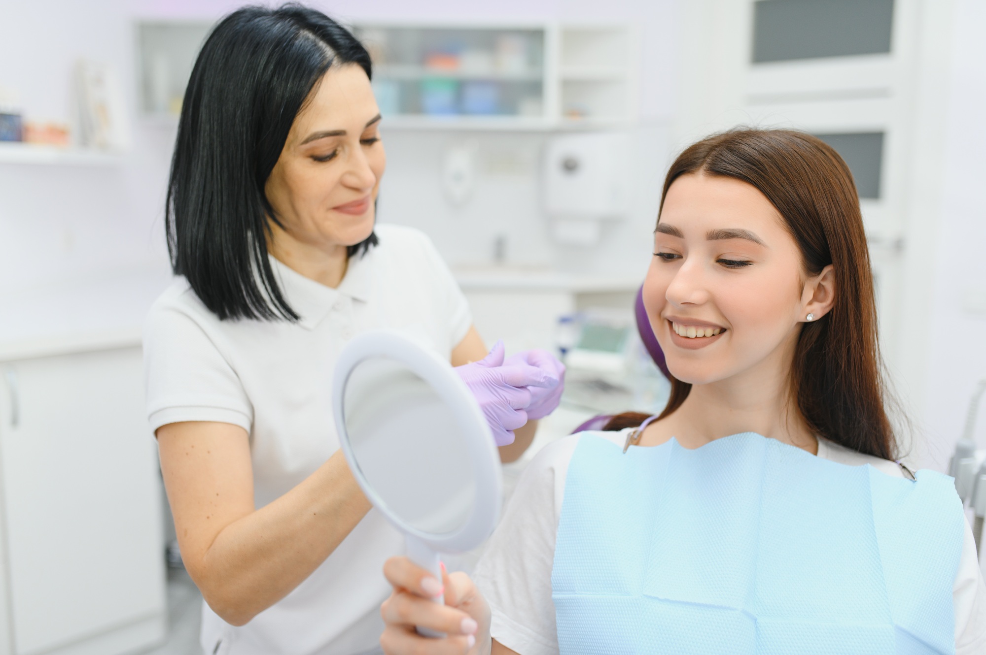 Dentist and patient in dentist office