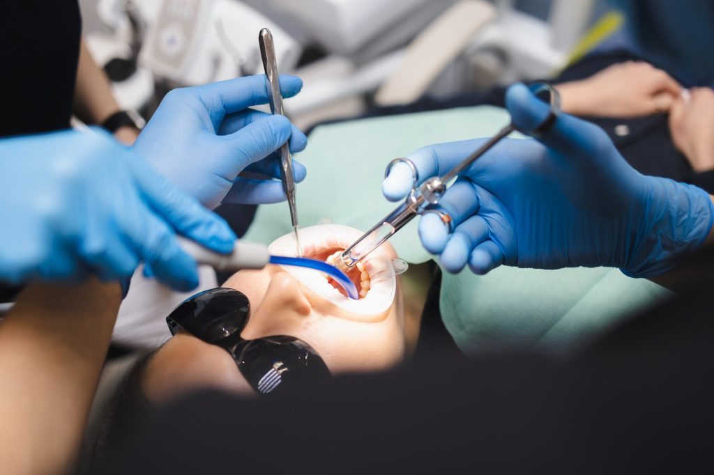 Doctor giving anesthesia to the patient before dental surgery